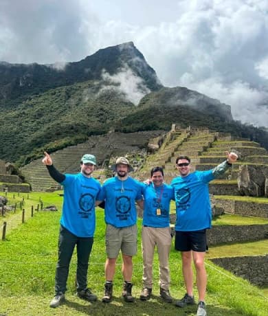 Group at Machu Picchu with terraces and misty mountains (Ultimate Inca Trail Tour, 5 days) | TreXperience