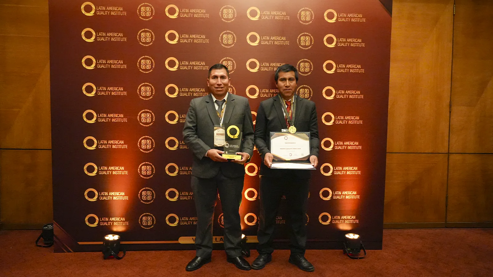 TreXperience team posing with Peru Quality Award recognitions.