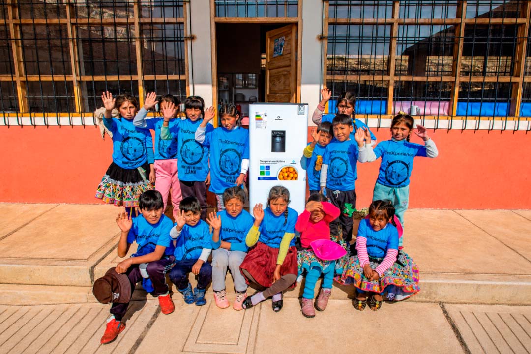 Children receiving a new refrigerator for their school | TreXperience