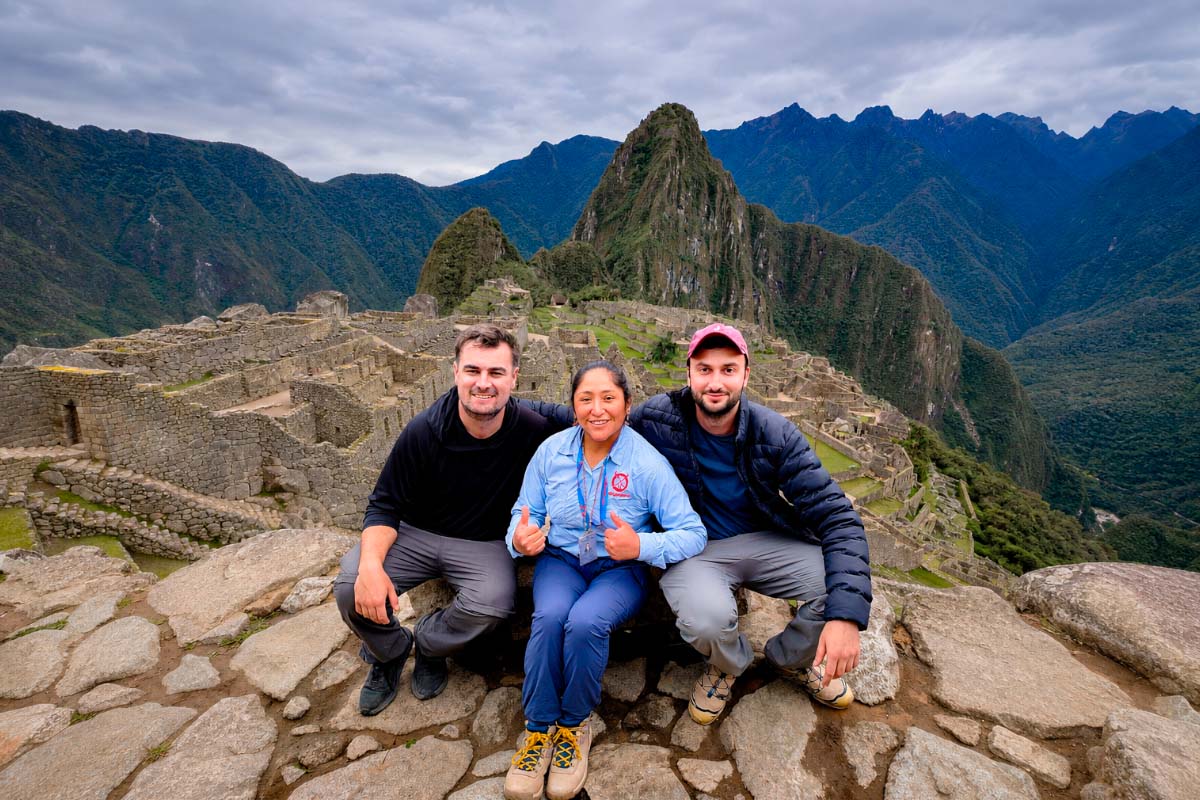 Travelers with a female TreXperience guide at Machu Picchu | TreXperience