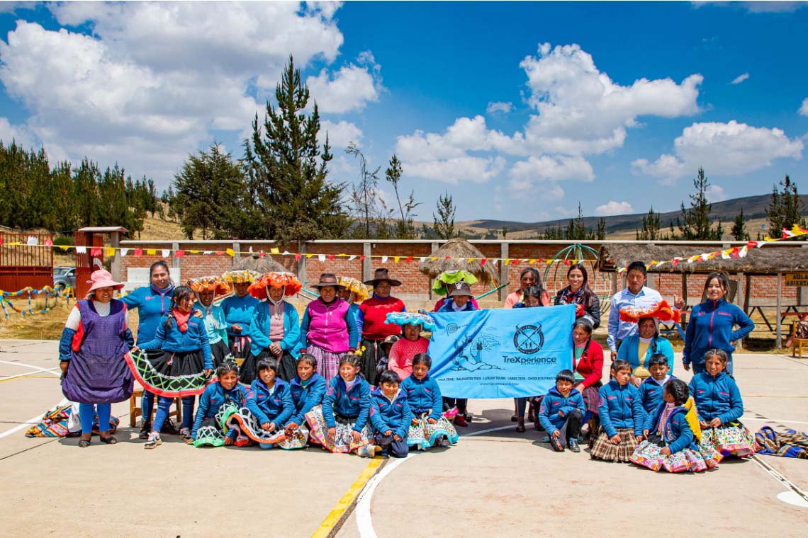 Mothers from a rural school with the TreXperience flag