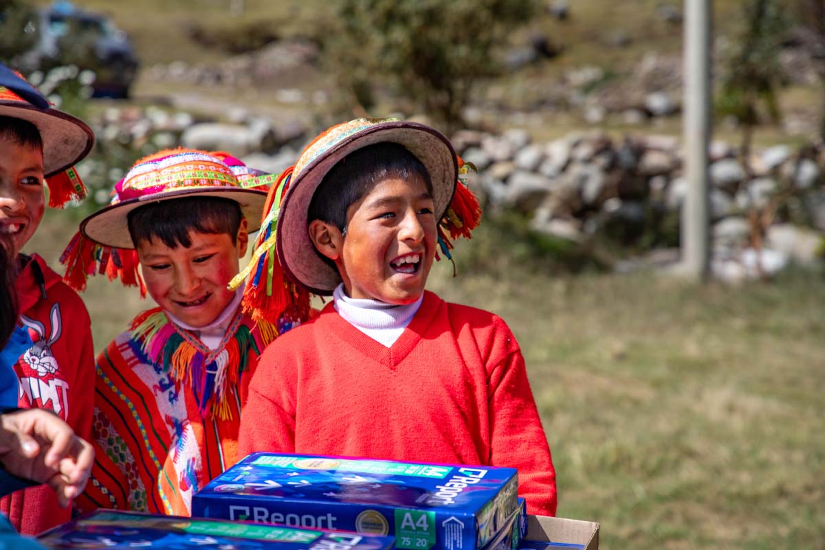 Qelqanqa child happy for the educational donation of TreXperience