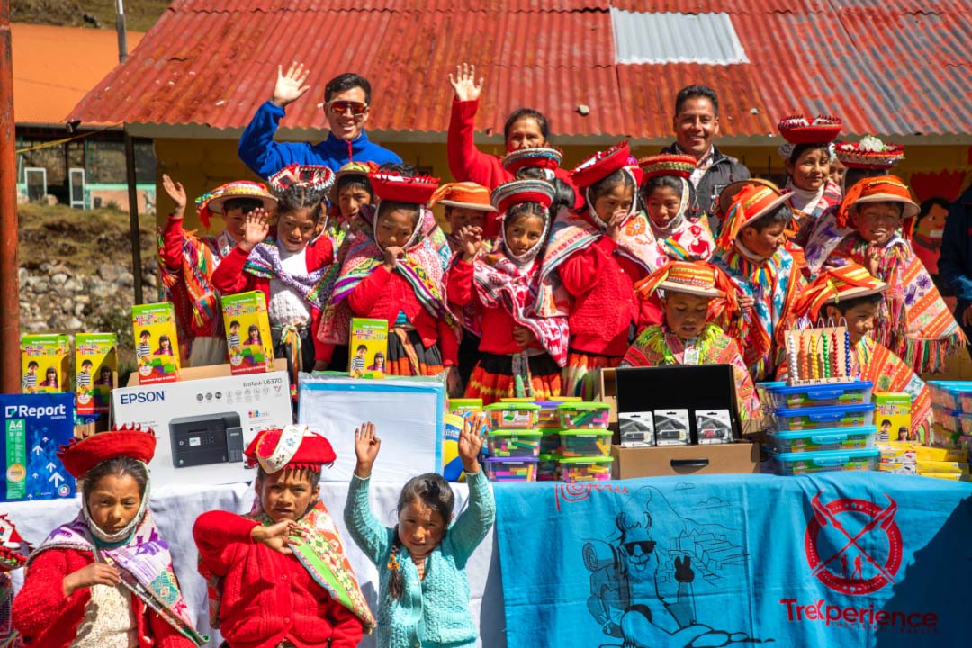 Qelqanqa children receiving their school donations | TreXperience