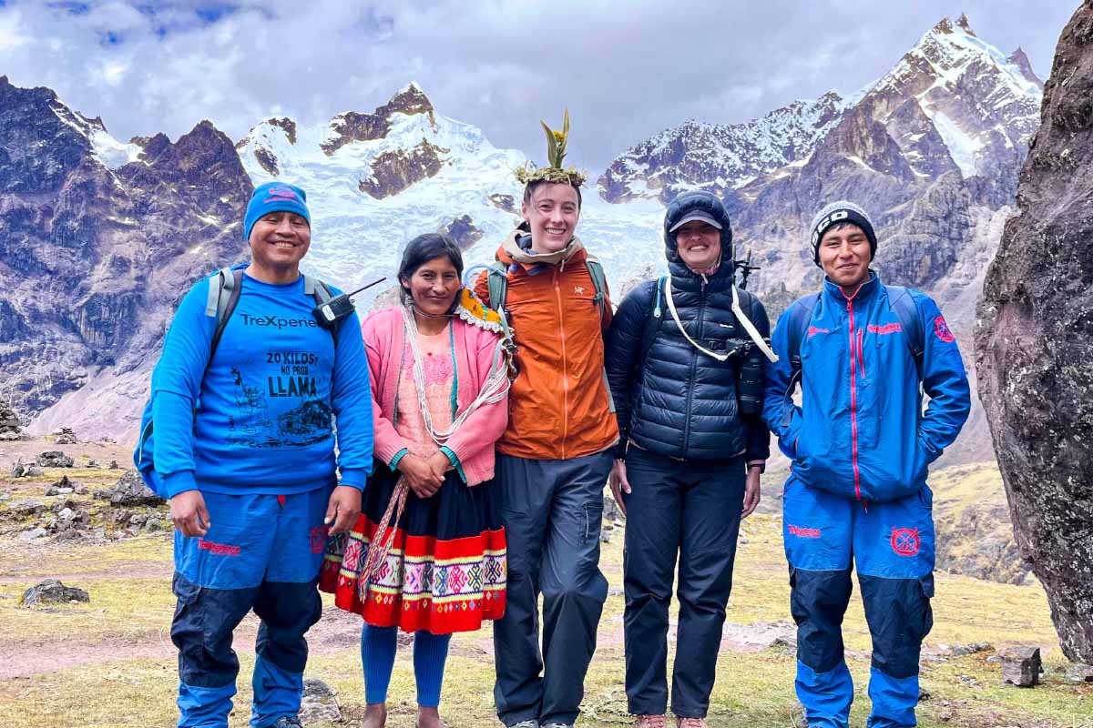 Tourists with TreXperience tour guides and an Andean woman