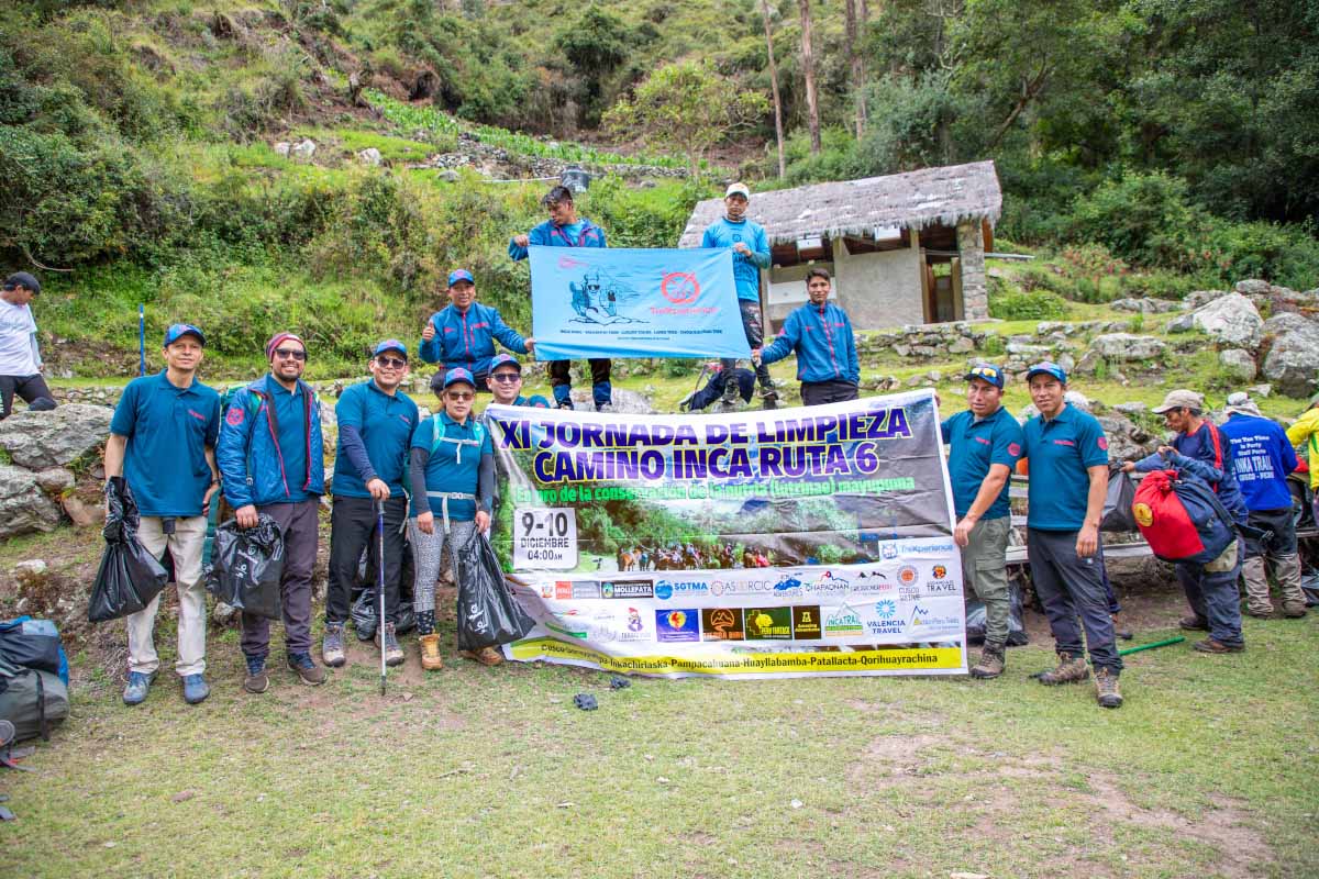 Trexperience staff with a banner during the Inca Trail cleanup campaign Trexperience staff with a banner during the Inca Trail cleanup campaign
