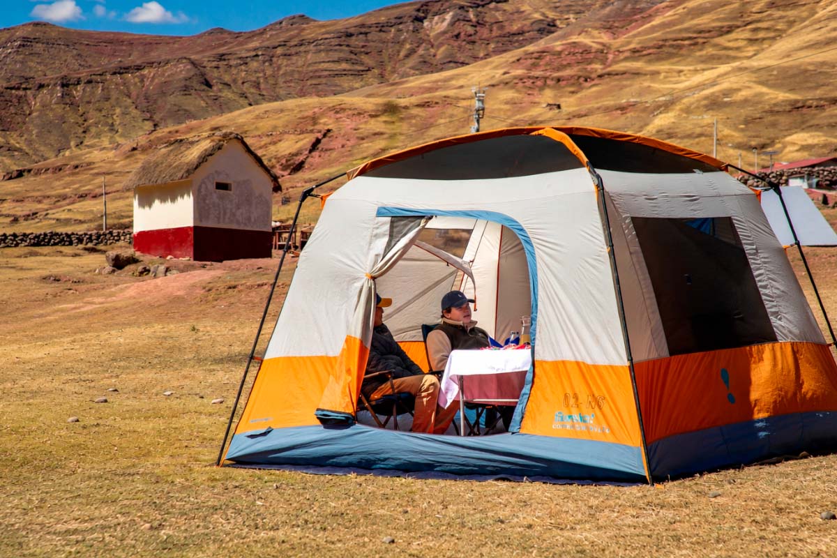 Large dining tent set up on mountain terrain Large dining tent set up in a mountainous area | TreXperience