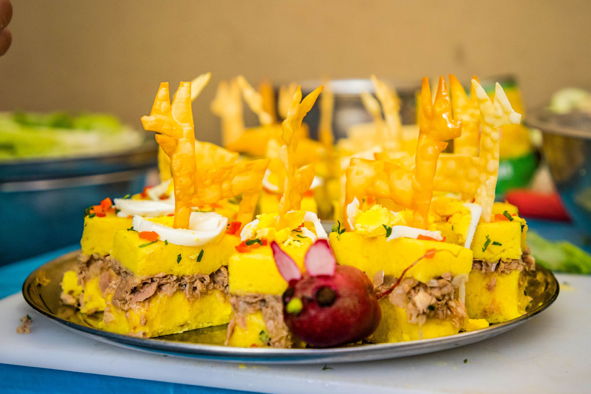 Several portions of dessert served on a tray, decorated with native Peruvian potato | TreXperience