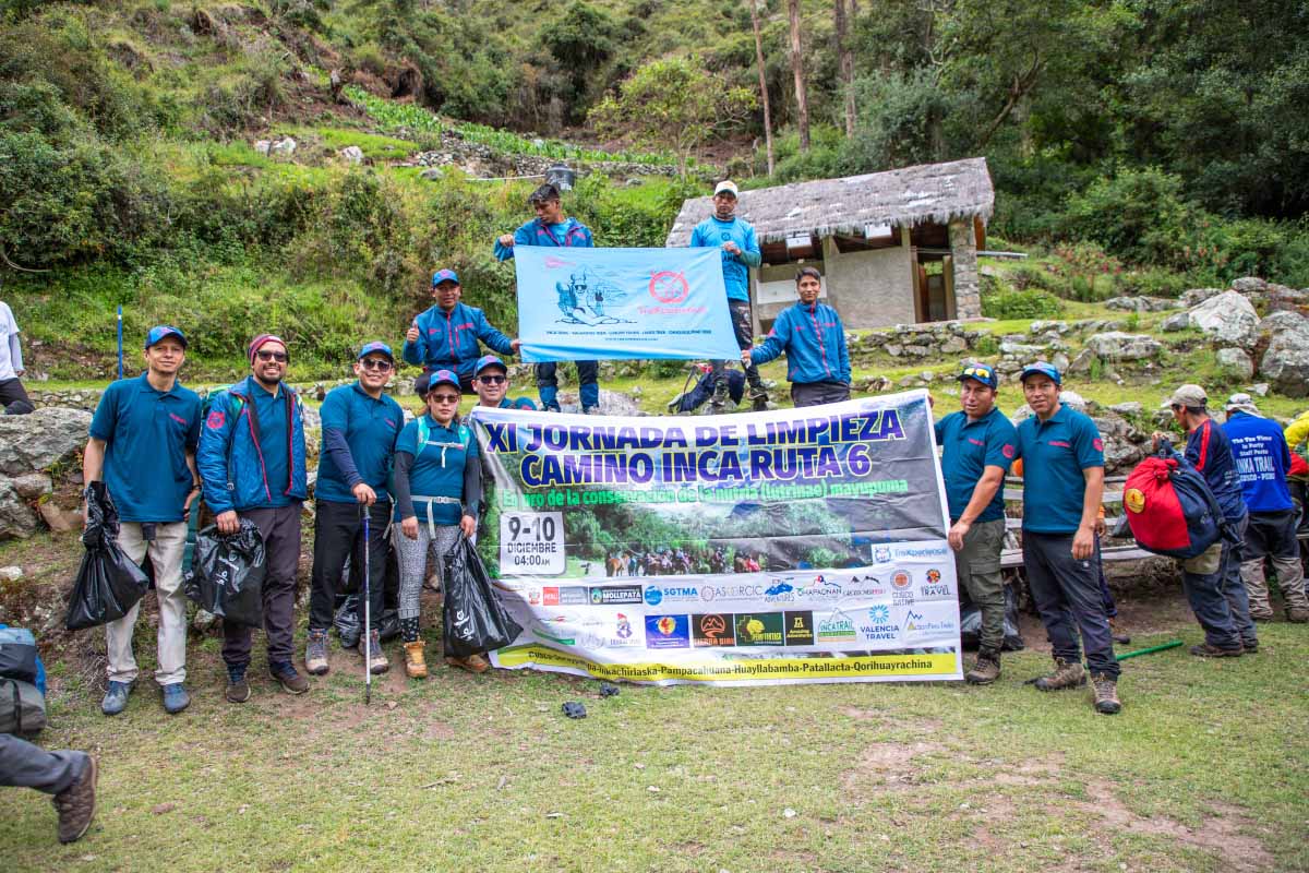 TreXperience staff with a cleaning campaign poster | TreXperience