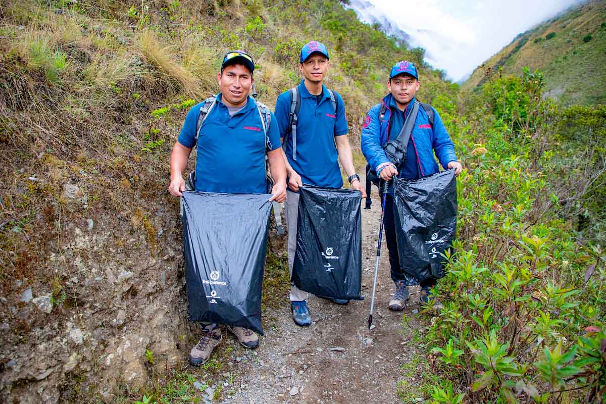 TreXperience staff with solid waste bags | TreXperience