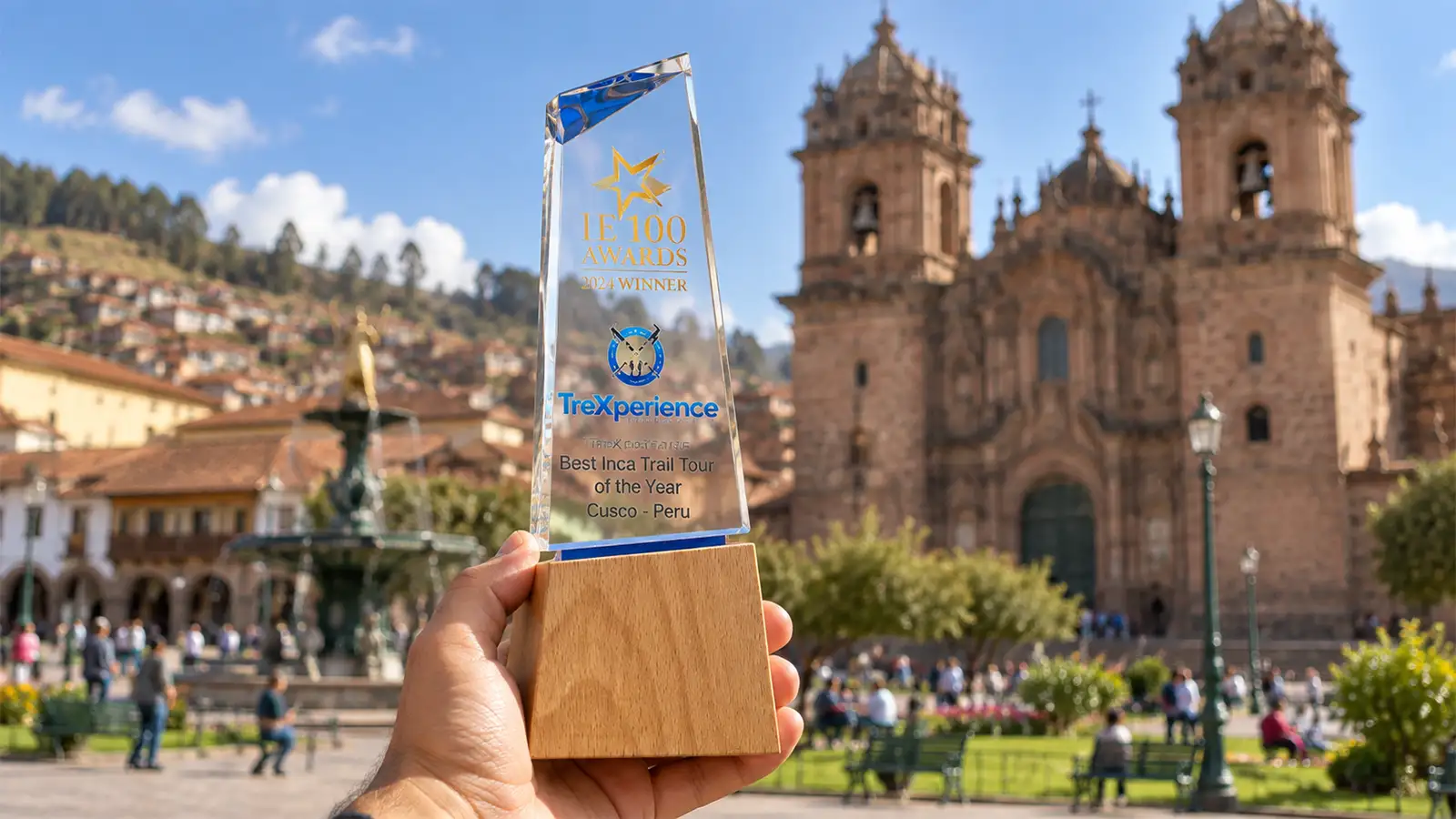 TreXperience IE 100 Prize and Cusco main square as a background