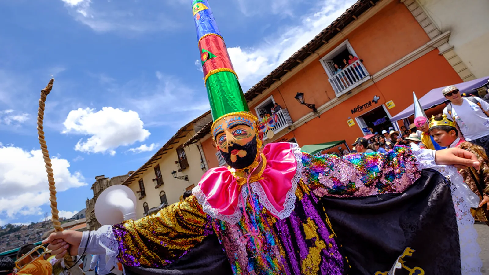 Colorful carnival costume and performer during the Cajamarca Carnival parade | TreXperience