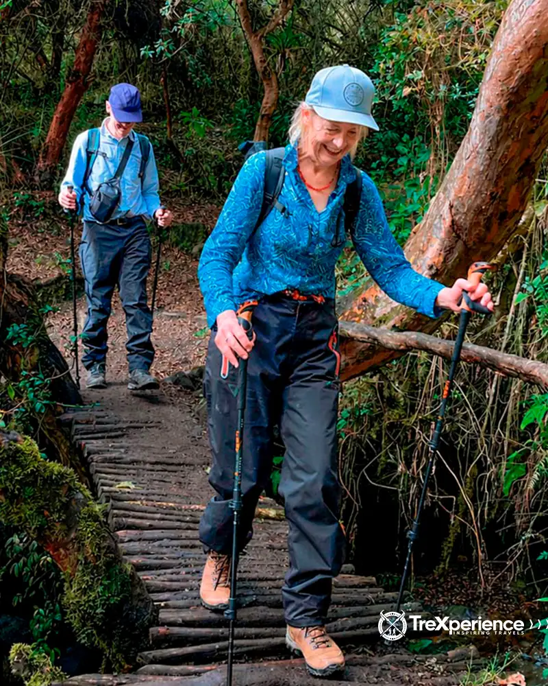 Couple crossing a bridge during the Inca Trail Couple crossing a bridge during the Inca Trail | TreXperience
