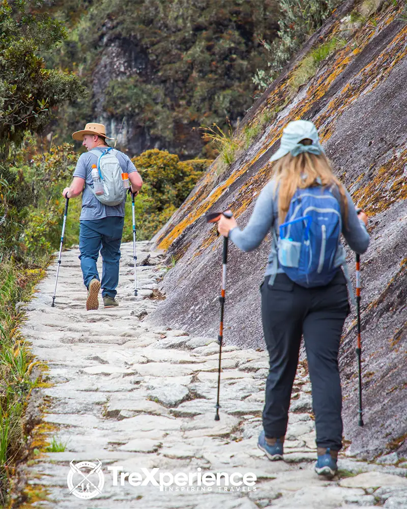 A couple of tourists hiking Route 01 of the Inca Trail A couple of tourists hiking Route 01 of the Inca Trail