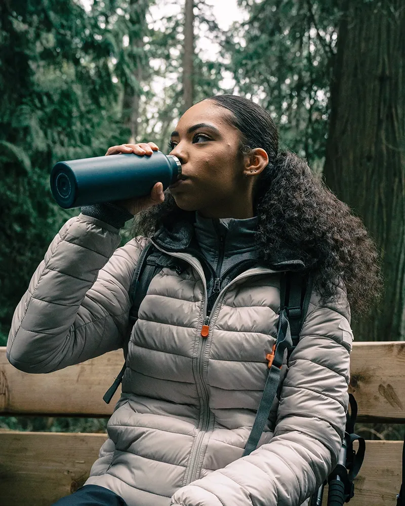 Woman drinking water - Tips for hiking the Inca Trail | TreXperience