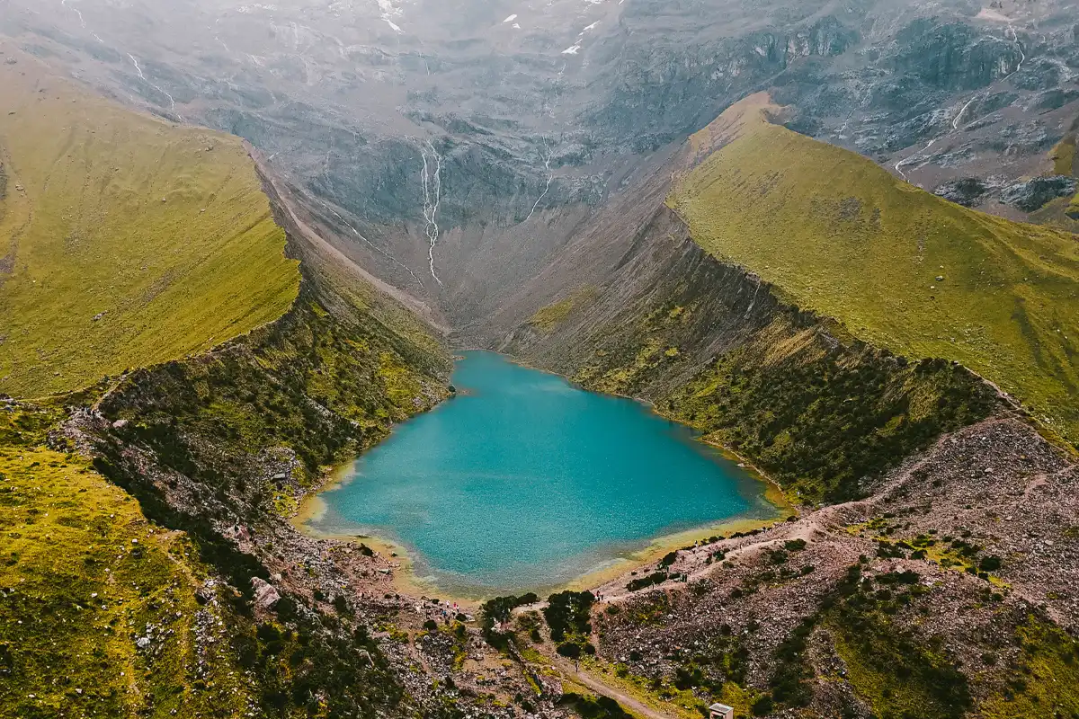 Drone View of Humantay Lake Aerial drone view of Humantay Lake, showcasing its turquoise waters.