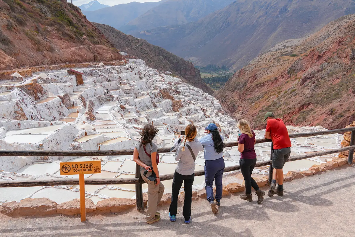 tourist visiting the Maras Salt Mines on the Inca Jungle trip | TreXperience