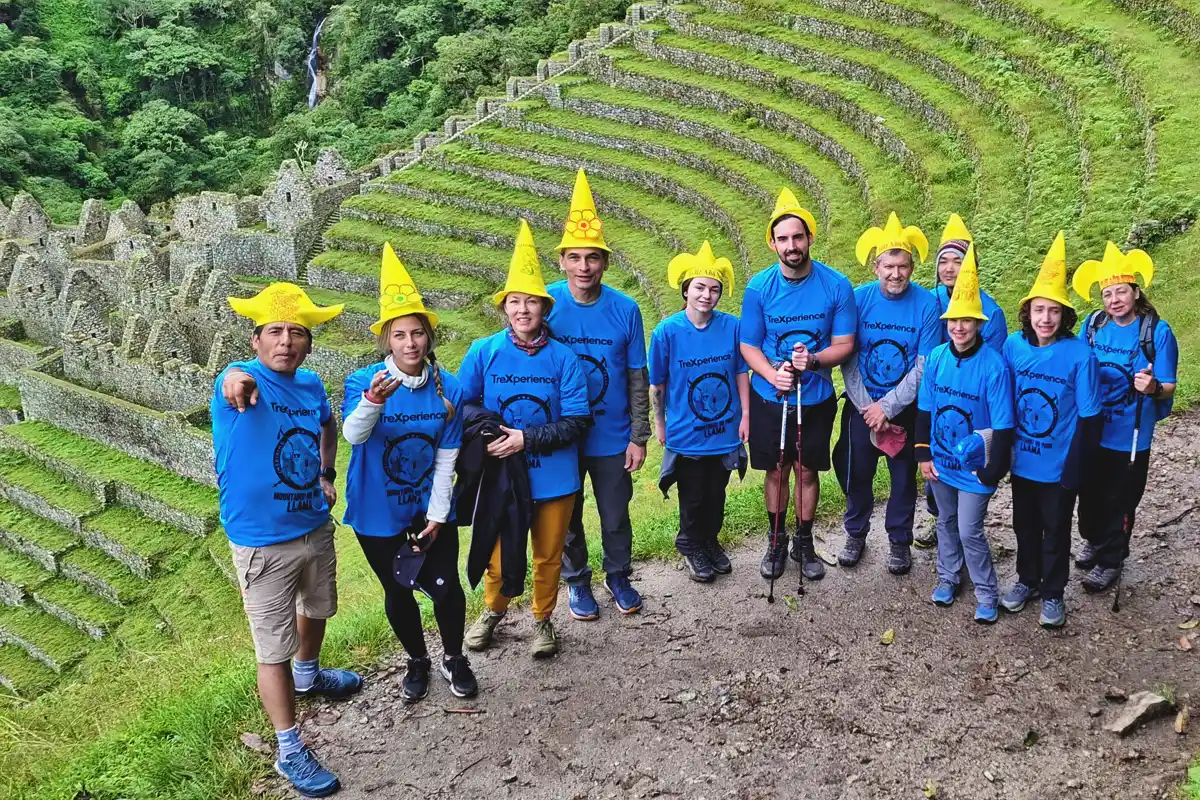 Inca Trail hiker at the Wiñay Wayna archaeological site, celebrating New Year Day.