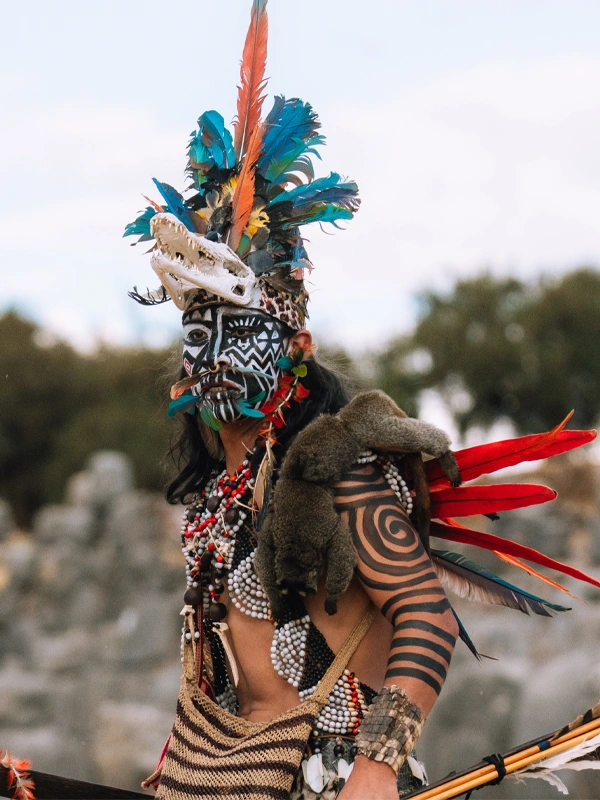 Man dressed as an Amazonian ethnic representative at Inti Raymi in Cusco Man dressed as an Amazonian ethnic representative at Inti Raymi in Cusco | TreXperience