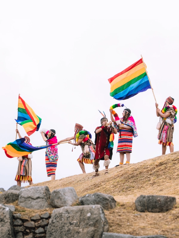 Waving the Flag of Cusco during the Inti Raymi in Sacsayhuaman Image of the Cusco flag being waved over Sacsayhuaman during Inti Raymi | TreXperience