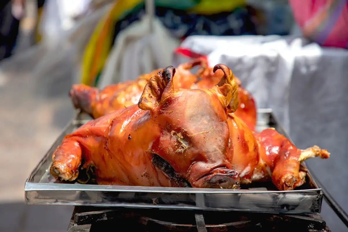 Photo of display of traditional lechón sold during the festive days.