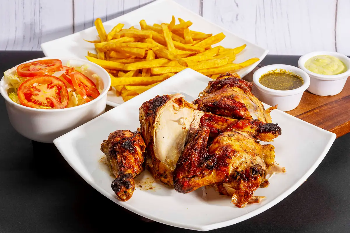 Pollo a la brasa served with its sides | TreXperience