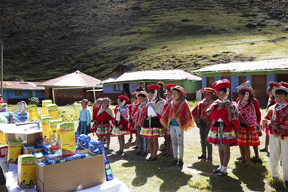 Qelqanqa children receiving educational donation from TreXperience Qelqanqa children receiving educational donation from TreXperience