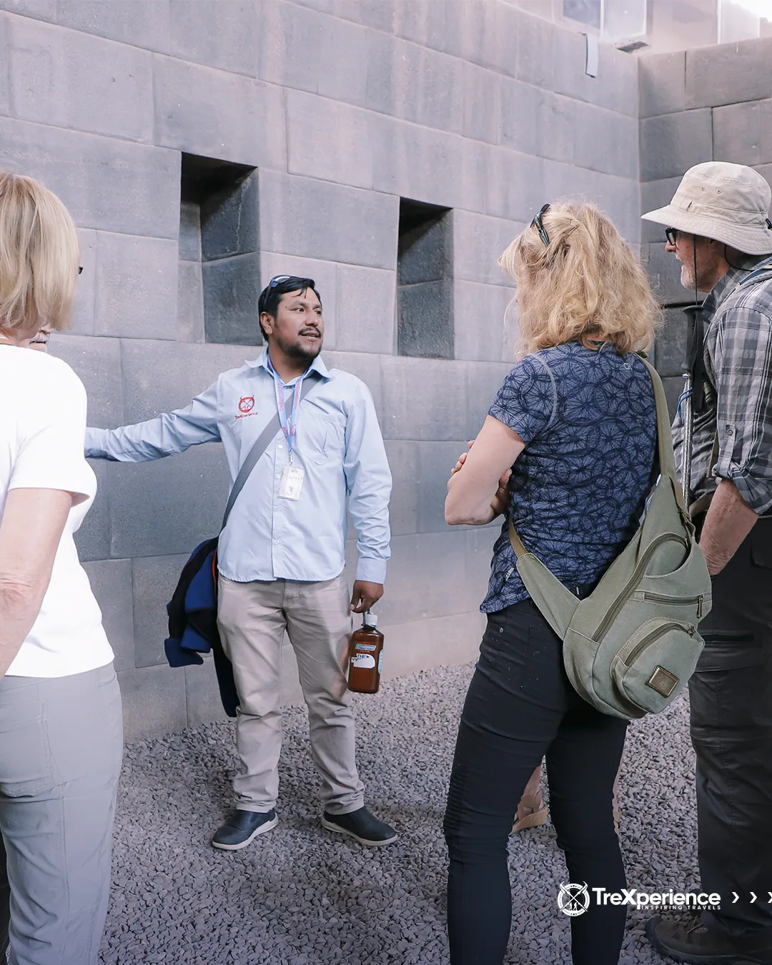 Tour Guide speaking to tourists in Qoricancha Temple, Cusco | TreXperience