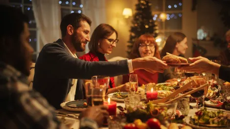 The 2026 Thanksgiving day dinner is highly anticipated in the U.S. People sharing bread during the 2026 Thanksgiving Day dinner