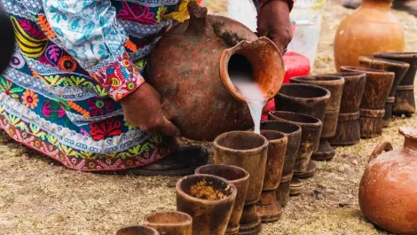 Chicha de jora served in a clay cup | TreXperience