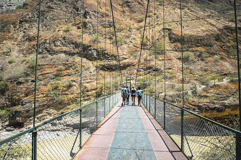 Bridge with a group of people - Choquequirao to Machu Picchu Expedition | TreXperience