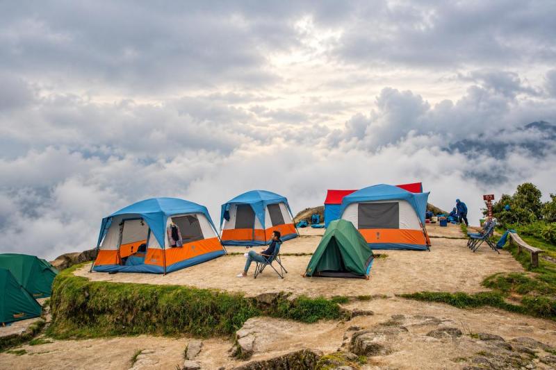 Walk-in tents at a Luxury Inca Trail campsite above the clouds