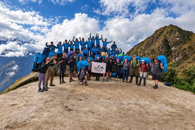 Hikers celebrating with their TreXperience porters, chef and guides on the Inca Trail