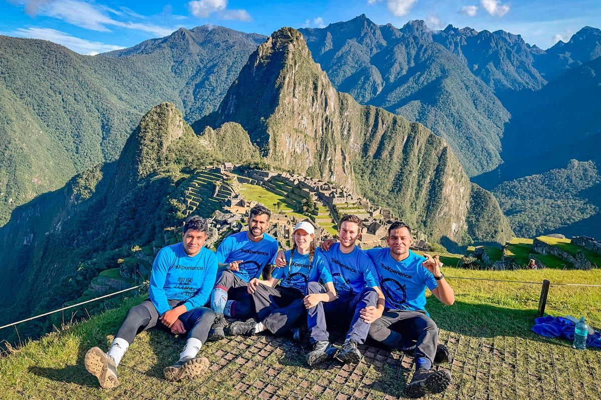 Tourists with trexperience guide with Machu Picchu as background | TreXperience