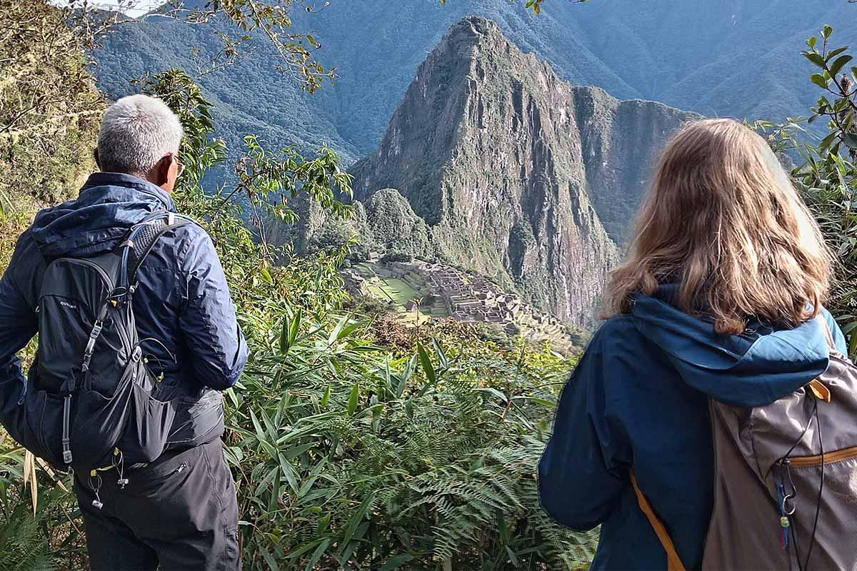 Couple looking Machu Picchu among weeds | TreXperience