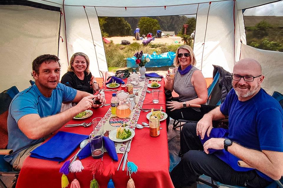 Lunch inside a dining tent with the Short Inca Trail group, with an Andean textile table setup | TreXperience
