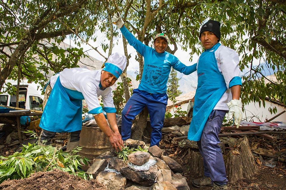 Pachamanca over the earth oven, hot stones and leaves in place - Salkantay Trek Luxury Tour 5 Days