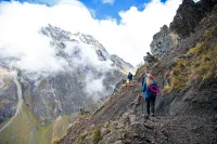 Trekkers on the pathway along the Salkantay hike
