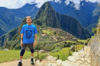 Traveler posing at Machu Picchu with Huayna Picchu in the background | TreXperience