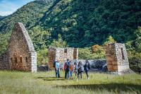 Traveler group exploring the Inca ruins of Chachabamba (Km 104) on the Short Inca Trail | TreXperience