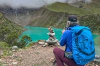 Taking a photo of an apacheta at Humantay Lake | TreXperience