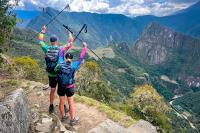 Couple contemplating Machu Picchu from the Inti Punku | TreXperience
