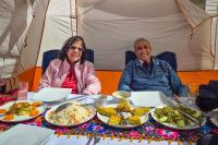 Couple enjoying a luxury lunch during the premium Rainbow Mountain Peru tour | TreXperience