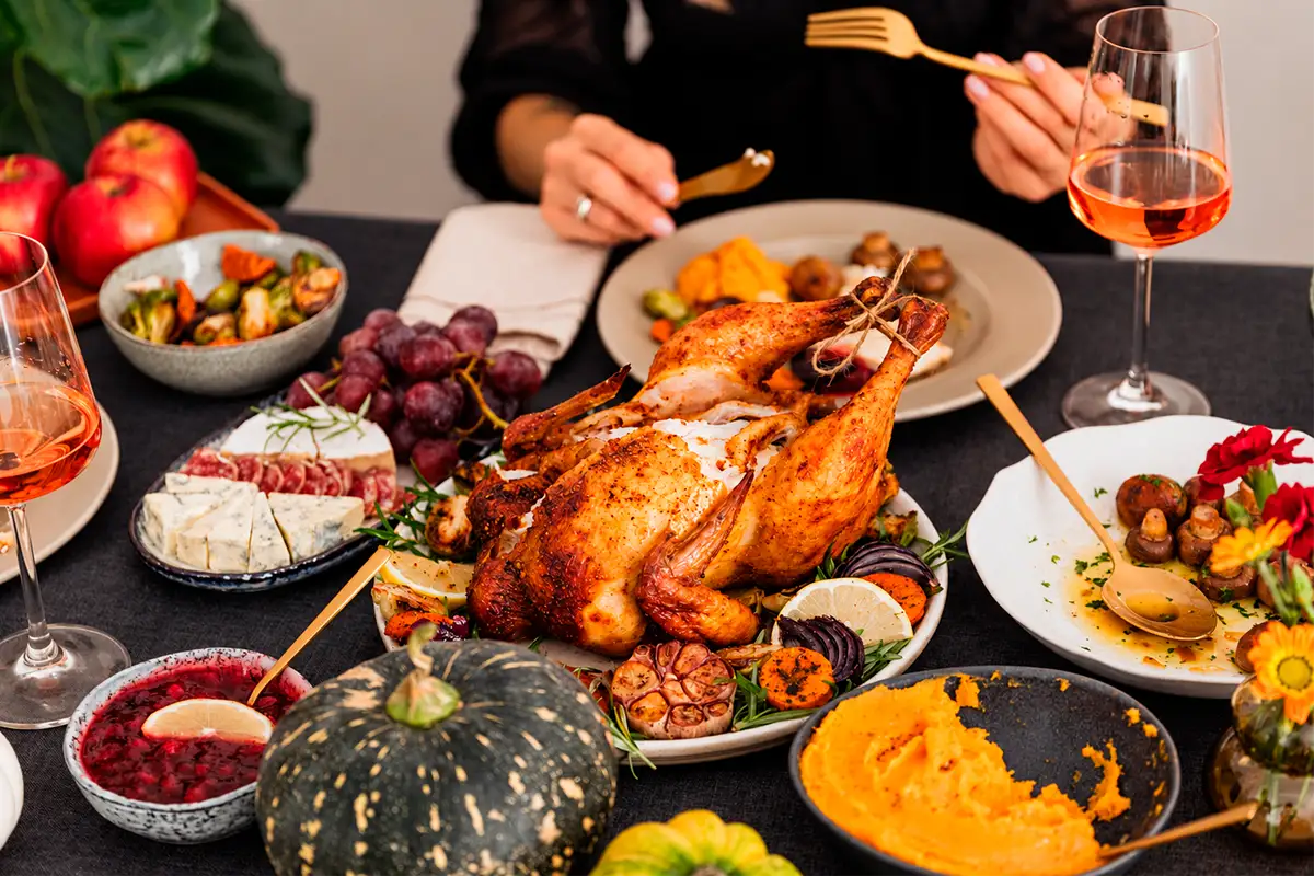 Woman eating roasted turkey at the 2026 Thanksgiving dinner | TreXperience