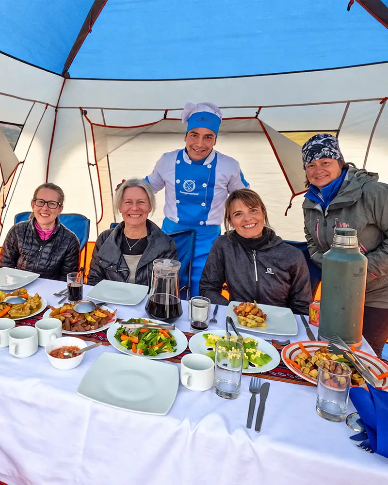 Family of travelers having a Thanksgiving lunch on the Inca Trail