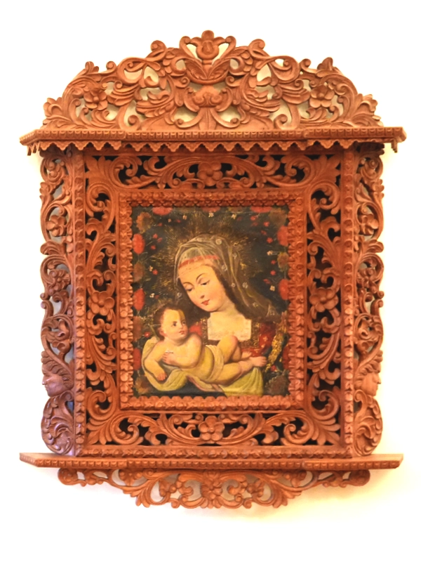 The Virgin and Child depicted in an Andean wooden panel painting at the Archbishop Palace, Religious Art Museum.