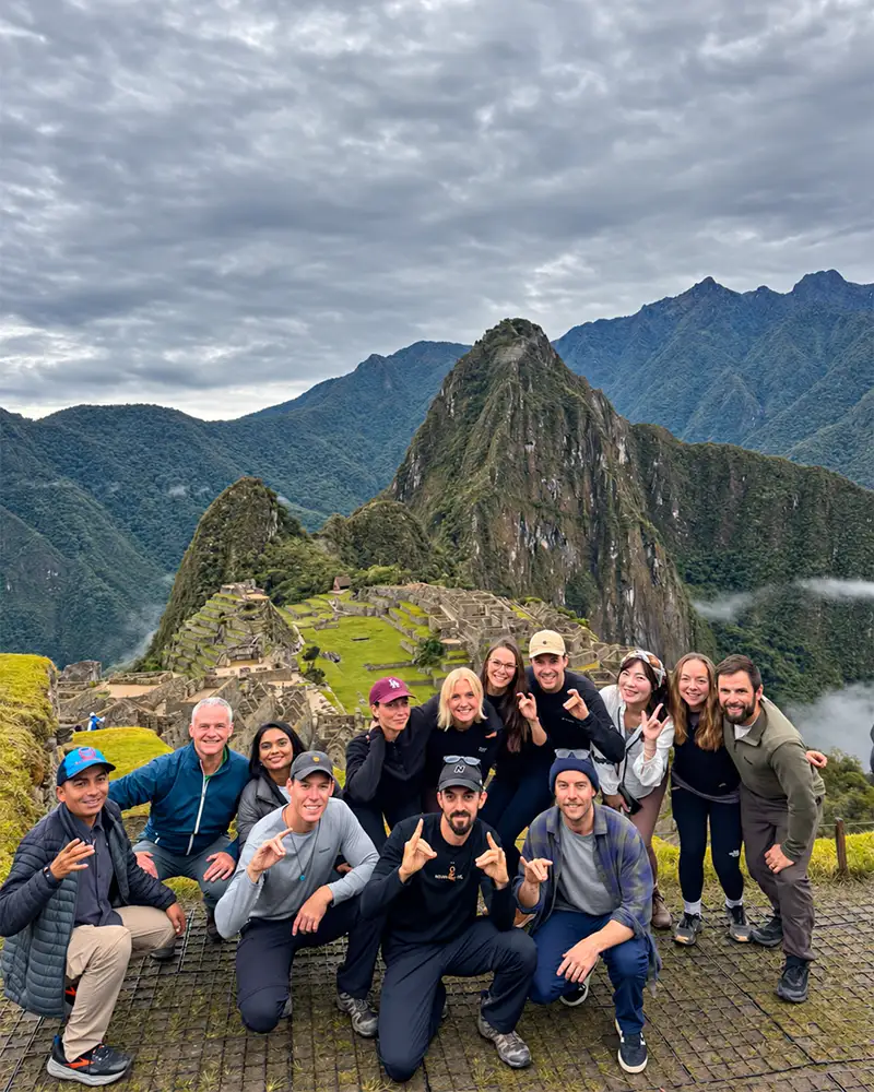 Group of travelers with Machu Picchu in the background in November