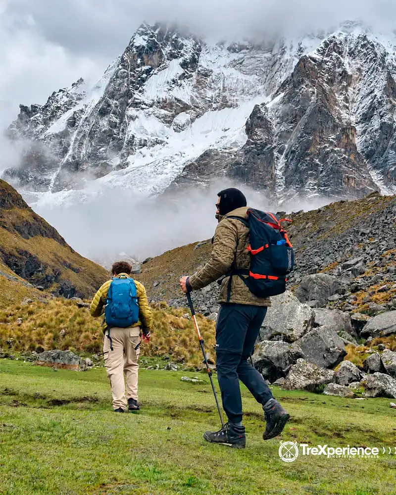 TreXperience visitors walking on the Salkantay slopes Trekkers walking on the Salkantay slopes
